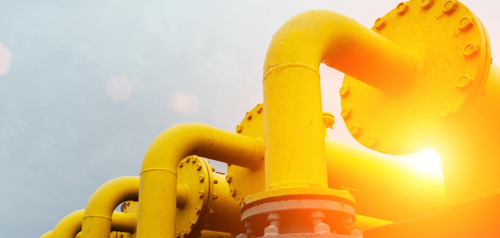 A series of three yellow pipelines (Credit: MVelishchuk/Shutterstock.com)